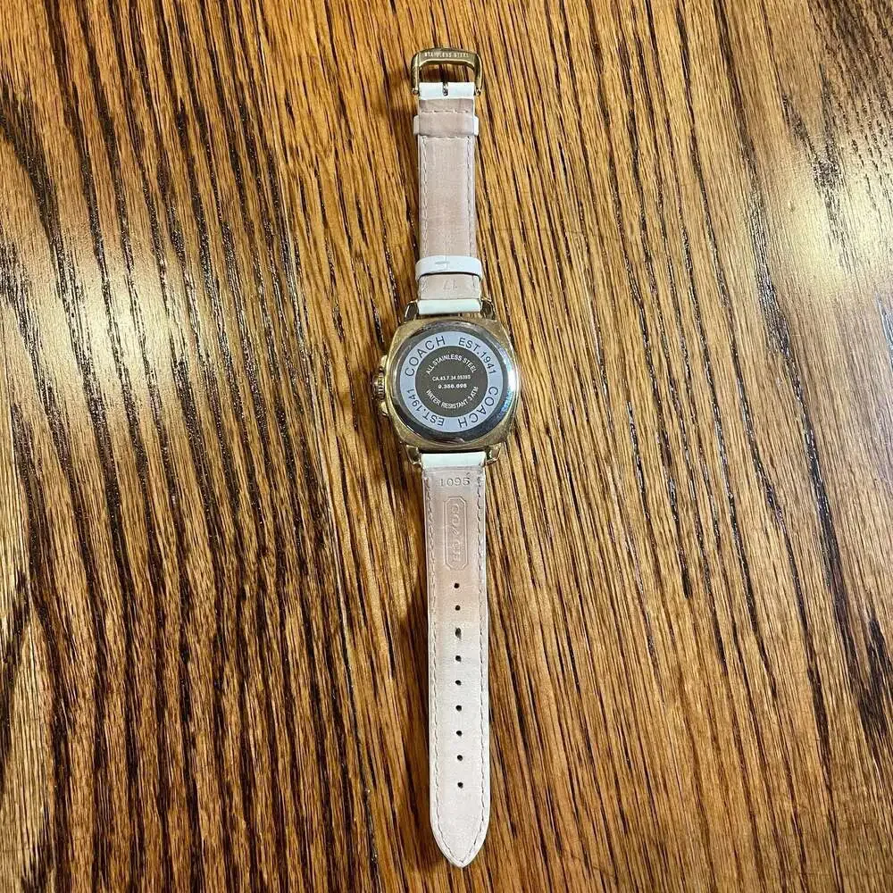 Coach Boyfriend Gold Tone Crystal Bezel Watch with White Strap